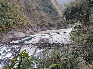 A broken hanging bridge, right next to the one we’re on!